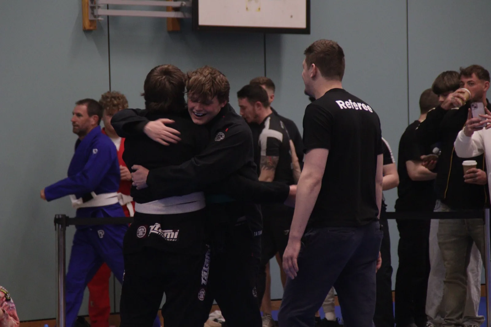 Tyler celebrating with a teammate after winning gold at SW Grappling 3